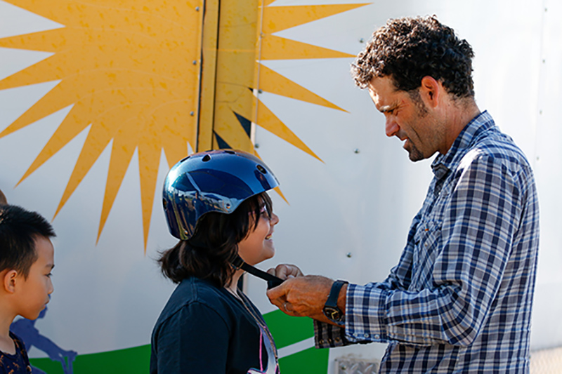 Instructor showing how to wear helmet